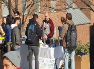 Ryan Karp, head of Chosen People Ministries, serves latkes, sufganiyot — and a Christian message — to Jewish students at the University of Maryland. Photo courtesy of UMD Hillel 