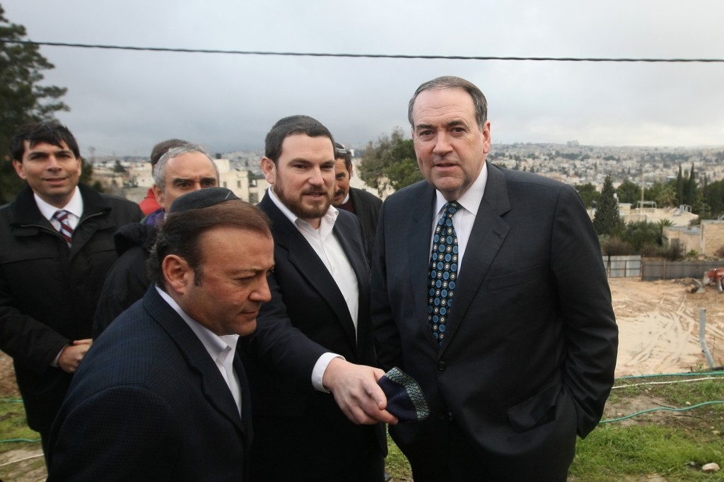 Former Arkansas governor and 2008 presidential candidate Mike Huckabee, right, during a visit with Knesset members and Jerusalem councilmen to the eastern Jerusalem Jewish neighborhood of Beit Orot in January.  Photo by Kobi Gideon/Flash90