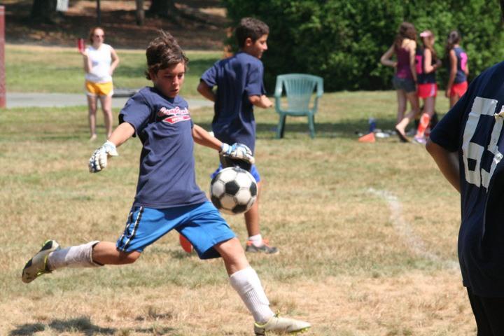 A junior varsity soccer player at Camp Ramah in New England competes in Yom Berkshires. Photo by Marcia Glickman