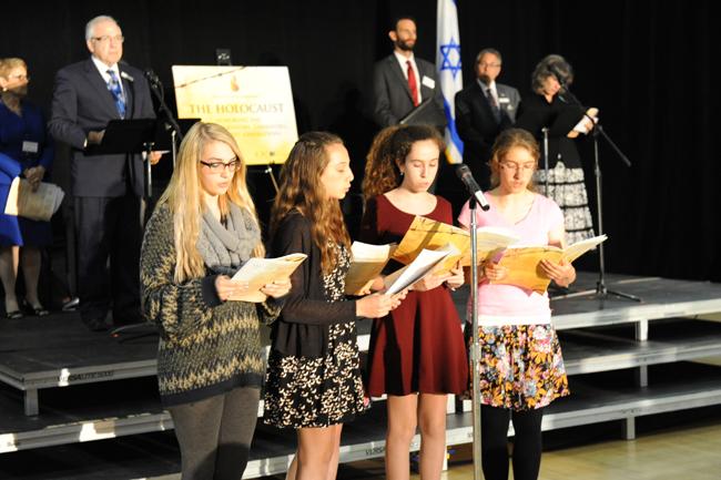 Teens from area synagogues and public schools read the "Pledge of Continuation," part of the intergenerational candle lighting ceremony.