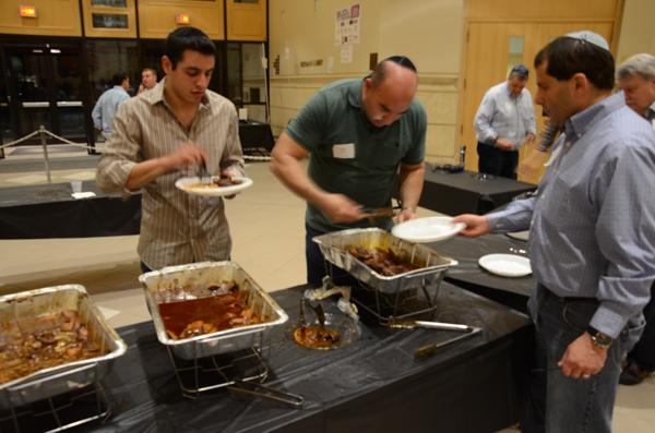 Beth Sholom's fourth annual Guys' Night Out featured ribs, grilled chicken and scotch for more than 500 attendees. Photos by Max Moline