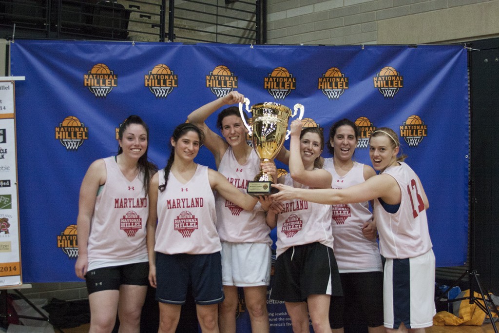 The winning University of Maryland’s women’s team poses with the winner’s cup. Photo by Lena Salzbank/The Diamondback 