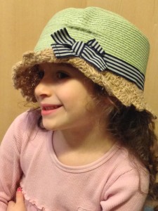 A girl models one of the hats at HATtitude 
