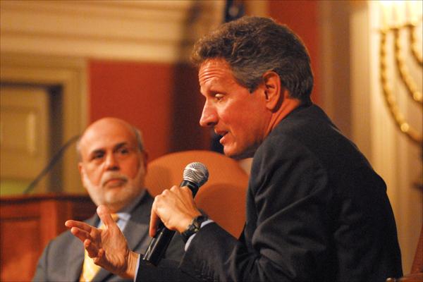 Former Treasury Secretary Timothy Geithner, right, said talking about economics with former Federal Reserve Chairman Ben Bernanke "is like talking about baseball with Mickey Mantle." Photo by Larry Luxner