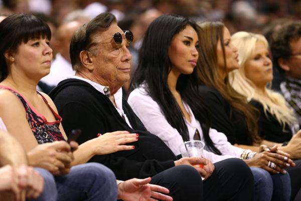 Los Angeles Clippers owner Donald Sterling is pictured here with V. Stiviano to his left at a 2013 basketball game. Photo by Ronald Martinez/Getty Images, courtesy of JTA News and Features