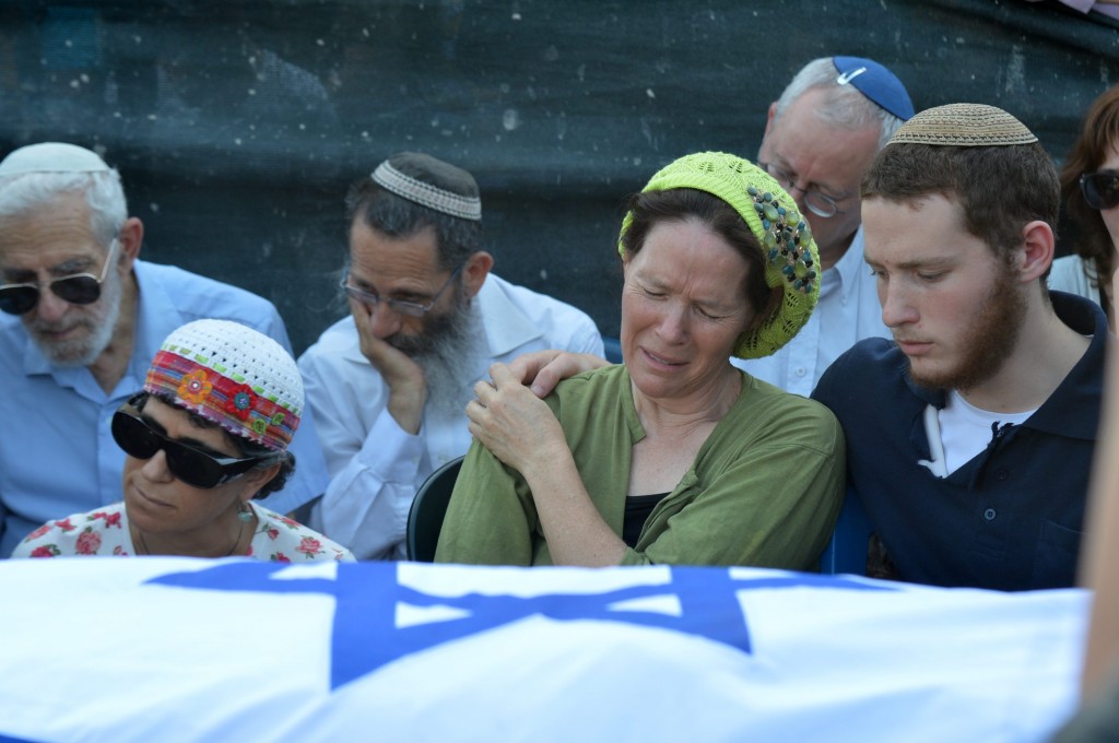 Rachel Frenkel cries over the body of her son Naftali Frenkel during the joint funeral for three murdered Jewish teens in the Modi’in cemetery on Tuesday. Photo by Flash 90