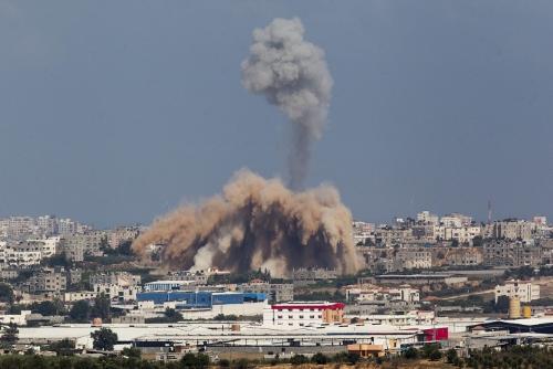 Smoke and debris rise after an Israeli strike on the Gaza Strip seen from the Israeli side of the Israel Gaza Border, on the second day of Operation Protective Edge, July 9, 2014. Photo by Yonatan Sindel/Flash90 