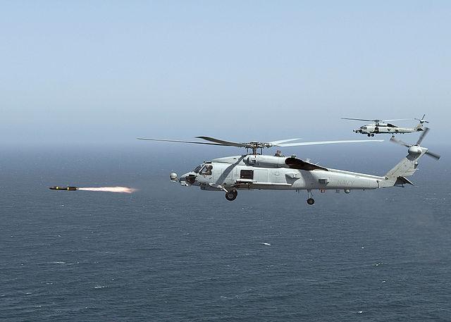 U.S. Navy helicopter fires an AGM-114 series Hellfire missile during a practice run. U.S. Navy photo by Mass Communication Specialist 2nd Class Mark A. Leonesio