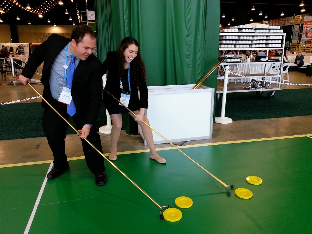 Nate Strauss, 20, president of the Jewish Student Union at Michigan State Hillel, and Shelby Bruseloff, 20, president at Grand Valley State Hillel in Michigan, play shuffleboard at the Jewish Federations of North America General Assembly at National Harbor, Maryland on Nov. 10. Photo by Josh Marks