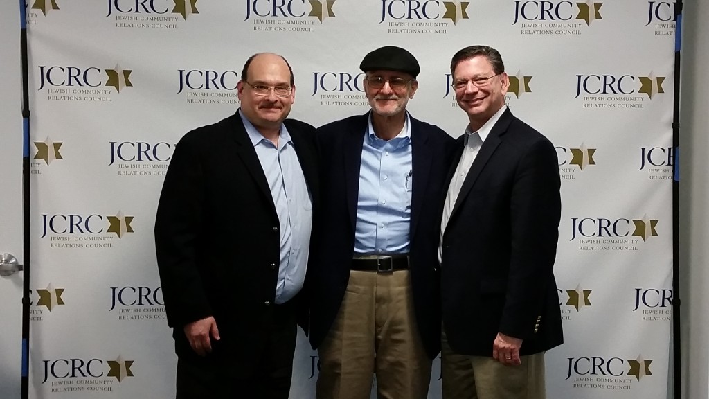 Ron Halber (left), JCRC executive director, and Steven Rakitt, CEO at Jewish Federation of Greater Washington (right) welcome Alan Gross home with a visit to the federation's new building.