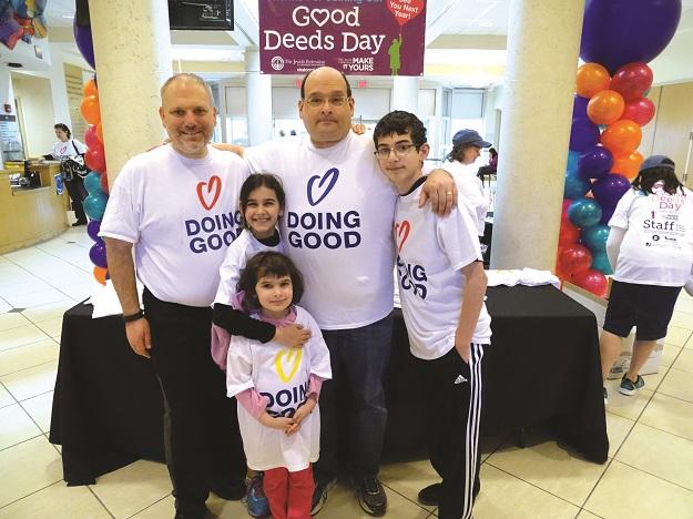 From left, William Daroff, vice president for public policy and director of the Washington office of The Jewish  Federations of North America (JFNA), poses with Ronald Halber, executive director of the Jewish Community  Relations Council of Greater Washington, and Halber’s  children, from left: Larissa, Shoshana and Alex, after volunteering at the JCC in Rockville.