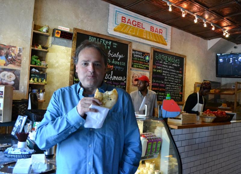Mosaic Theater Company of DC Artistic Director Ari Roth gets his bialy fix at Bullfrog Bagels on H Street.Photo by Josh Marks