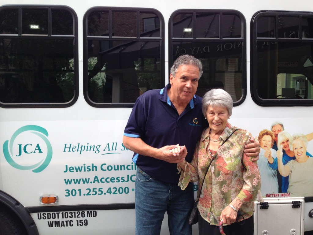 Montgomery County’s Senior Center Transportation Program, operated by the Jewish Council for the Aging of Greater Washington under contract with Montgomery County Recreation, recently earned an Achievement Award from the National Association of Counties. Pictured are a JCA Elderbus driver and passenger standing in front of a bus.Photo courtesy of Jewish Council for the Aging