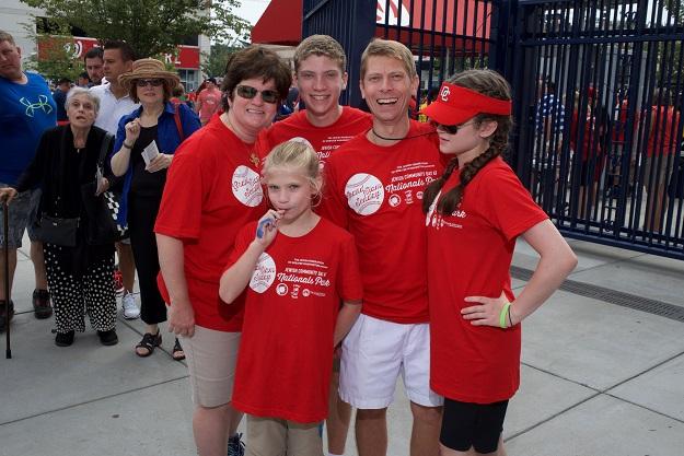 A family poses for a picture at Jewish Community Day at Nationals Park.