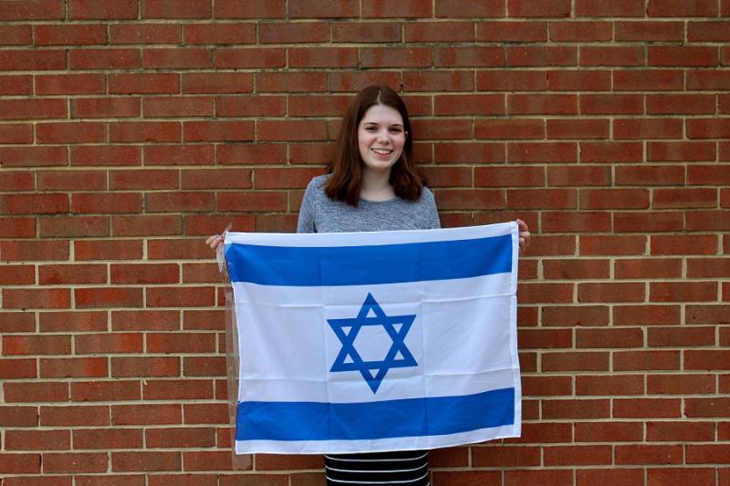 Eliana Lebson holds an Israeli flag.Photo by Abbie Salamon