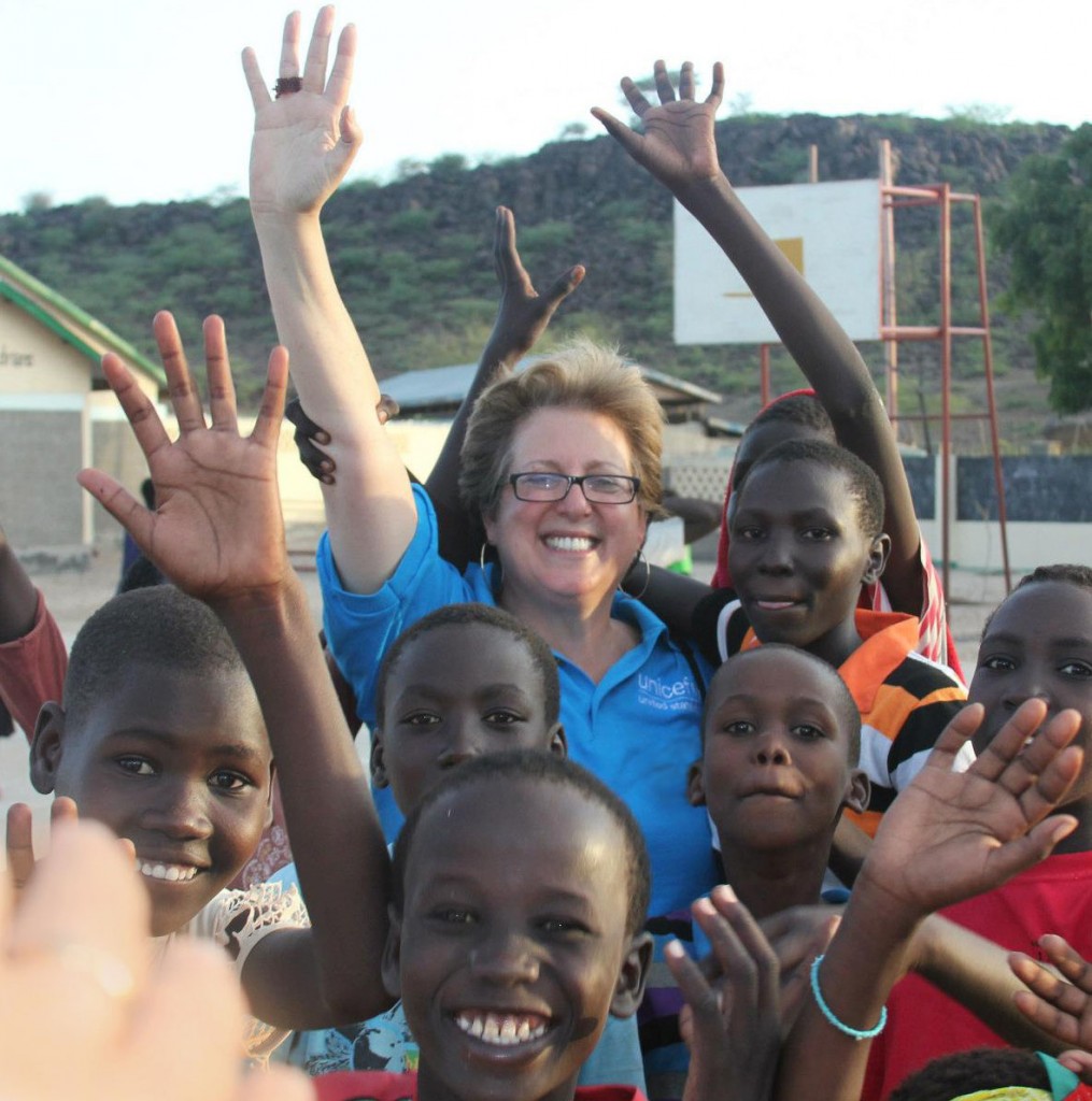 U.S. Fund for UNICEF President and CEO Caryl Stern waves with children in Lodwar, Kenya.Photo courtesy of the U.S. Fund for UNICEF