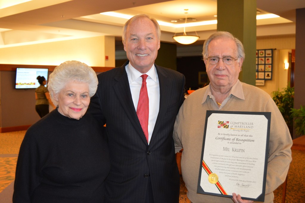 On Oct. 30, Maryland Comptroller Peter Franchot presented Mel Krupin, longtime  manager of the legendary Duke Zeiberts and then owner of Krupin’s Deli, with a  proclamation at Riderwood Village, where Krupin now lives. Pictured: Franchot, center, with Mel Krupin and wife, Gloria Krupin.Photo courtesy of Comptroller’s Office 