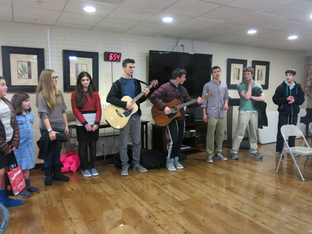 Kemp Mill students sang Chanukah songs for residents of the Arcola Health and Rehabilitation Center in Silver Spring on Dec. 8.Photo by Miriam Friedman 