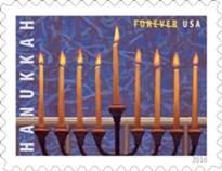 The U.S. Postal Service previewed its 2016 holiday-themed stamps that will be issued later this year. The Hanukkah stamp features an illustration of a menorah in the window of a home. Artist William Low highlighted the contrast between the hot candle flames and the cool snow, the vertical candles and the horizontal window frame, and the dark menorah with lit candles. Ethel Kessler was the art director.Courtesy of U.S. Postal Service