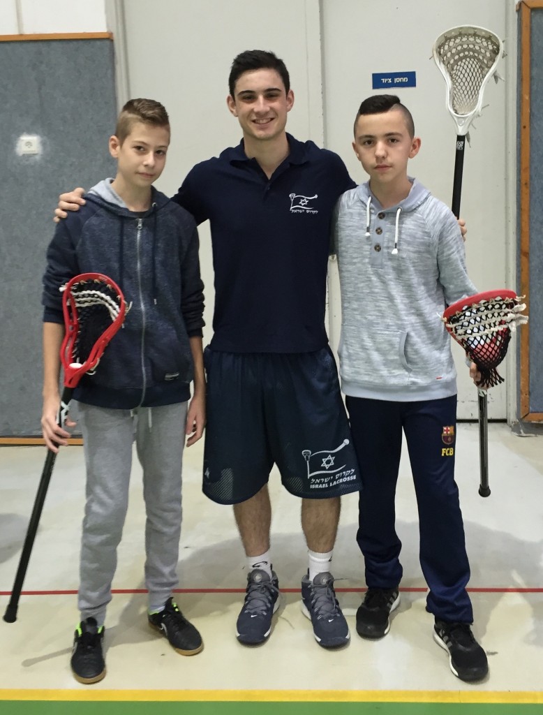 Jules Jacobs, center, with Israeli children at a lacrosse clinic in Netanya. SportPic