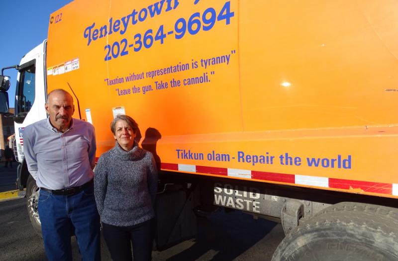 Owner Barney Shapiro, left, and COO Hallie Clemm stand in front of one of the Tenleytown Trash company’s trucks. Photo by Suzanne Pollak