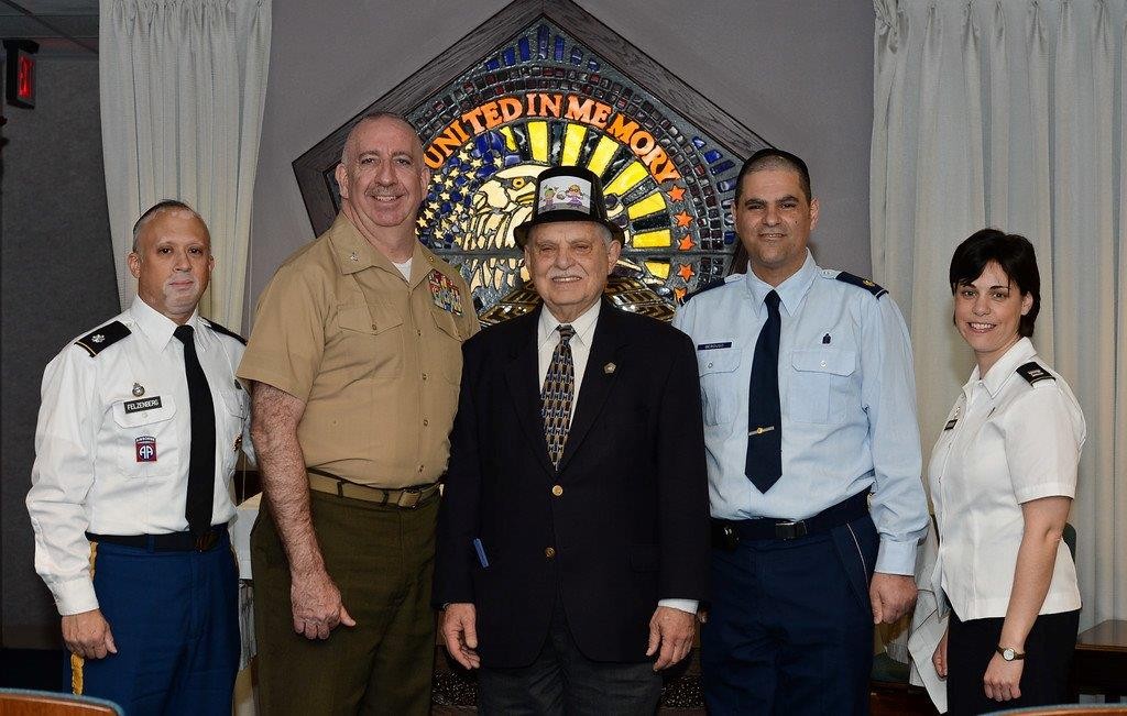 The Pentagon celebrated Purim with five rabbis/chaplains embracing three military services. From left: Lt. Col. Shmuel Felzenberg (Army), Capt. Irving Elson (Navy), Rabbi Marvin Bash (Pentagon), Maj. Raphael Berdugo (Air Force), Capt. Heather Borshoff (Army).Photo provided