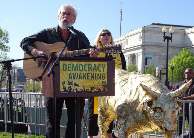 Rabbi David Shneyer performs Sunday at a vigil in Washington during Democracy Awakening. Photo by Josh Marks
