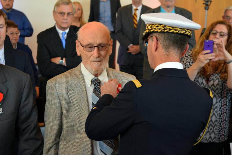 Samuel Katz receives the insignia of the National Order of the Chevalier of the Legion of Honor at a ceremony on April 15 at the French Embassy in Washington. Photo courtesy of French Embassy