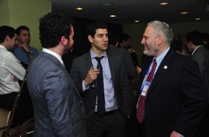 Chanan Weissman, center, speaking with Jewish Federations Washington director William Daroff, right, and Jordan Hirsch. (Ron Sachs from CNP/Courtesy of Jewish Insider)
