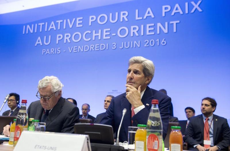 Secretary of State John Kerry, right, looks on at the June international summit in Paris to revive the Israeli-Palestinian peace process. Photo by Saul Loeb/AFP/Getty Images via JTA 