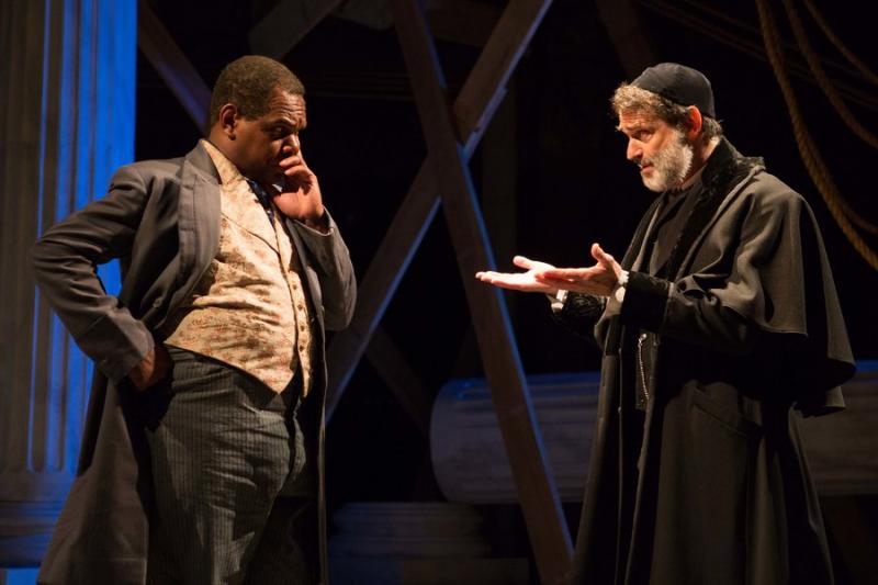 Shylock (Matthew Boston, right) works out the terms of his loan with Antoine (Craig Wallace) in Aaron Posner’s District Merchants, a variation of The Merchant of Venice. Photo by Teresa Wood 