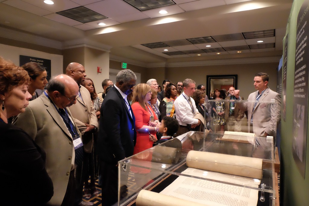 Participants at an event sponsored by Yad Vashem and the Museum of the Bible view the Codex Valmadonna I, the only surviving Hebrew text from England dated before the expulsion of the Jews in 1290.  Photo by Jake Romm