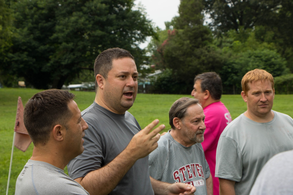 Jim Kaplan, second from left, rallies his team from Congregation Olam Tikvah before the game’s start.