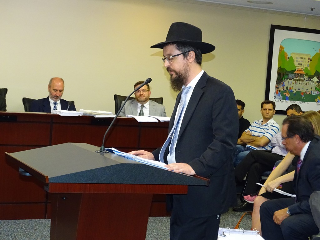 Rabbi Shlomo Beitsh addresses the Rockville Planning Commission on Wednesday. Photo by Jared Feldschreiber