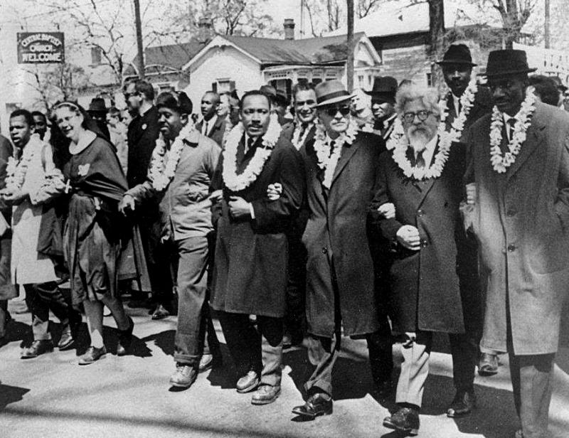 Rabbi Abraham Joshua Heschel, second from right, marches with Martin Luther King Jr., center, and other civil rights leaders from Selma to Montgomery, Ala., in 1965.