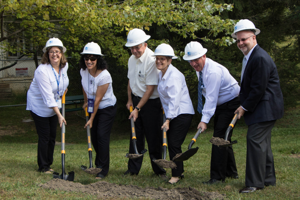 Breaking ground on Sunday are, from left, Michelle Pearlstein, JCCNV development associate; BJ Shiff, campaign co-chair; Al Pesachowitz, campaign co-chair; Connie Pesachowitz, campaign co-chair; Jeff Dannick, JCCNV executive director; and Scott Brown, president and campaign co-chair. Photo by Justin Katz