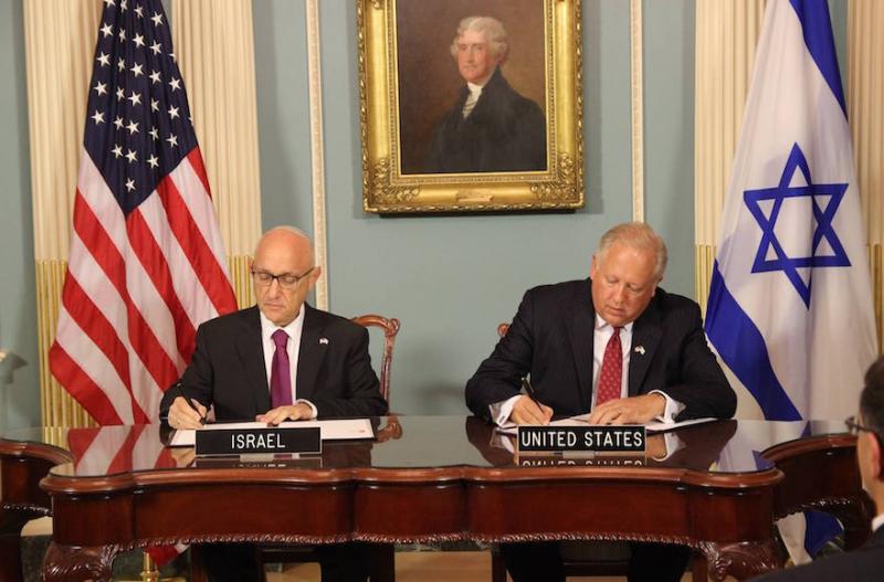 Jacob Nagel, left, Israel’s acting national security adviser, signs a Memorandum of Understanding for $38 billion of U.S. defense assistance over 10 years with Under Secretary of State Tom Shannon, on Sept. 14. Photo: Embassy of Israel