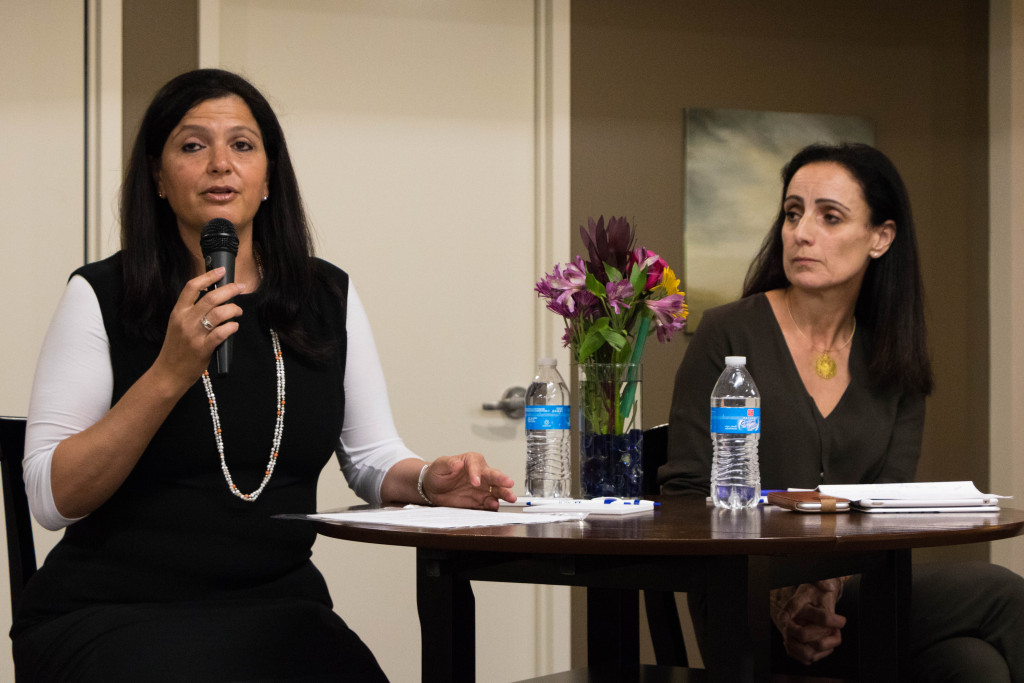 Nili Davidovitz, left, and Reem Younis discuss their journeys in Israel’s technology field with a group of 75 women at Hera Hub DC. Photo by Justin Katz