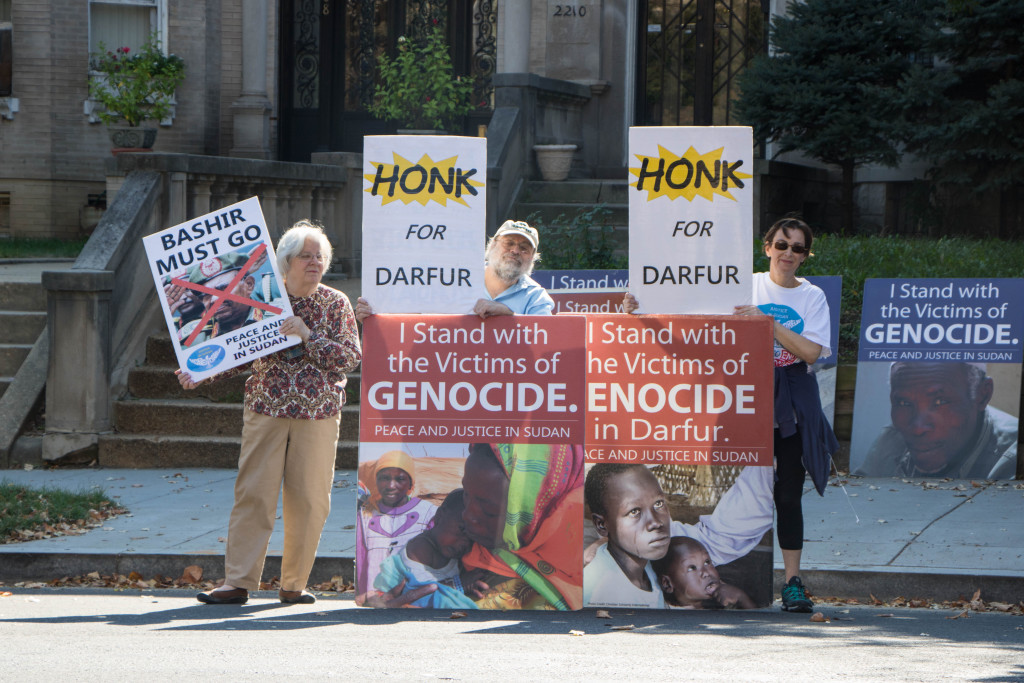 From left: Jeanne Tustian, David Allbaugh and Laura Cutler have spent years  demonstrating outside the Sudanese embassy in protest of the genocide in Darfur. (Photo by Justin Katz)