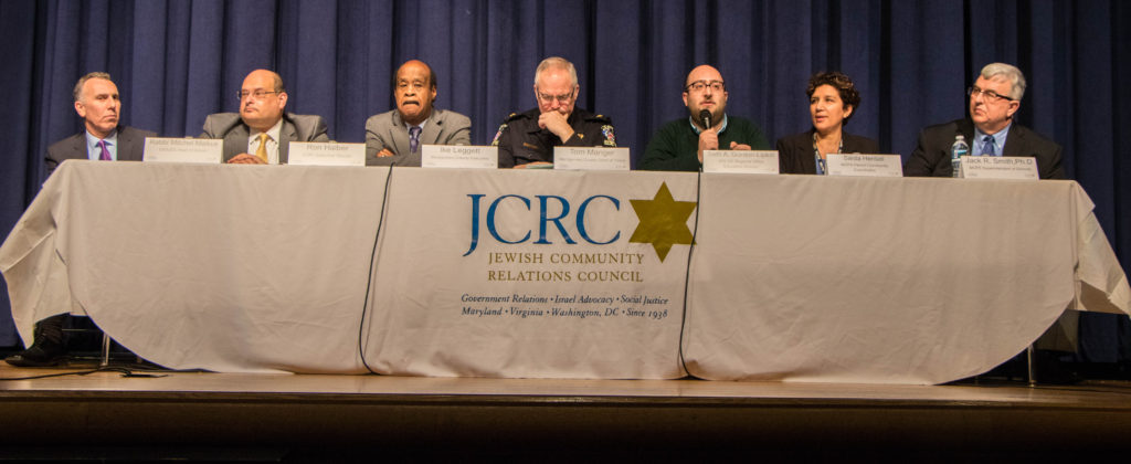 Participating in a forum on anti-Semitic acts in Montgomery County are, Rabbi Mitchel Malkus, head of Charles E. Smith Jewish Day School; Ron Halber, executive director of the Jewish Community Relations Council of Greater Washington; Montgomery County Executive Ike Leggett; Montgomery County Police Chief Tom Manger; Seth Gordon-Lipkin, of the Anti-Defamation League; Saida Hentati, Montgomery County Public Schools parent community coordinator and Montgomery County Public Schools Superintendent Jack Smith. Photo by Justin Katz 