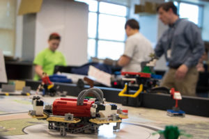 Students at Charles E. Smith Jewish Day School spent their Friday afternoon programming robots to deliver a cargo load. Photo by Justin Katz
